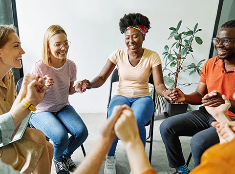 group of people holding hands