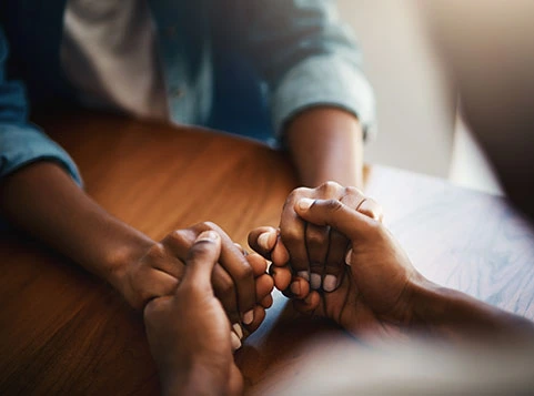 two people holding hands